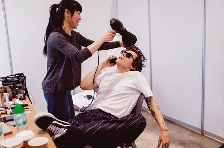 Harry Styles Having His Hair Blow Dried Wearing a white shirt