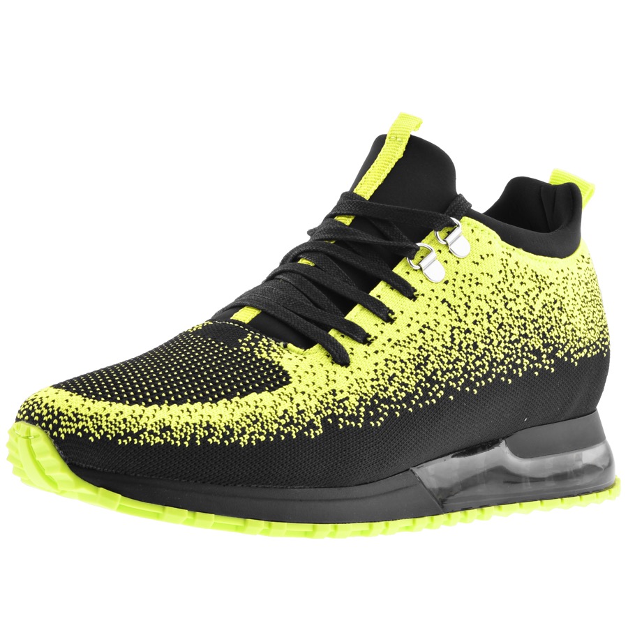 Mallet Tech trainers in black and dotted neon green highlighting